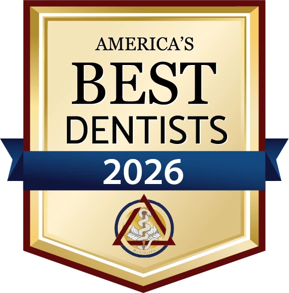 A badge awarding the clinic as one of America's Best Dentists 2026