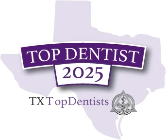 A badge awarding the clinic as a 2025 Top Dentist